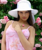 Eve Angel, brunette, strip, g-string, flowers, hat, outdoors