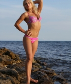 Laura, blonde, strip, bikini, rocks, sea