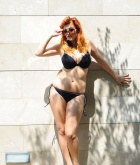 Lucy Vixen, redhead, strip, topless, busty, retro