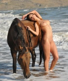 Suzanna A, brunette, nude, busty, horse, beach